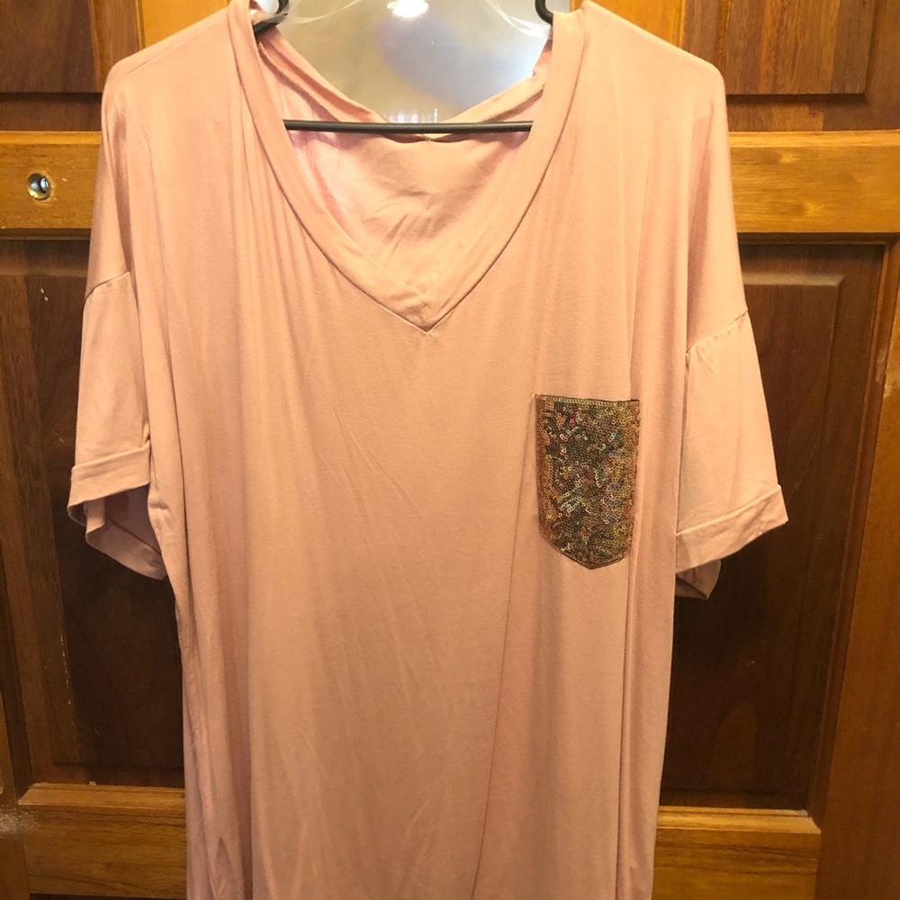 Blush colored top with sequined pocket
